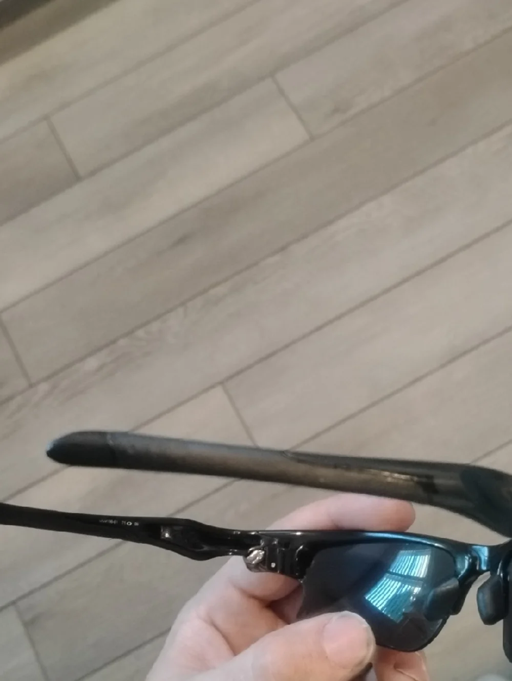 Oakley Black Frame Sunglasses with Gray And Orange Lenses